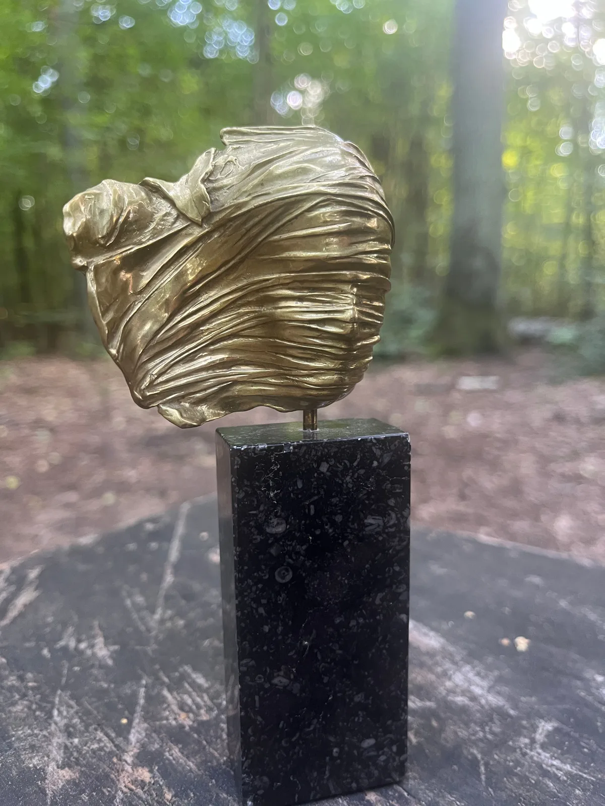 Visage Voilé — Mitoraj gilded bronze, close view of tightly worked drapery